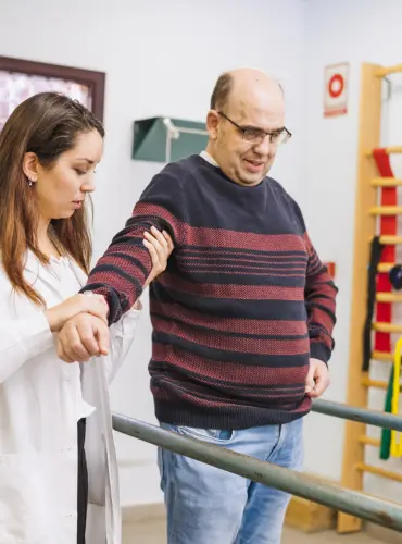 Physiotherapist providing ataxia physiotherapy treatment at home in Karachi