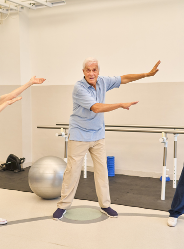 Physiotherapist providing physiotherapy treatment for balance problems in elderly patients at home in Karachi