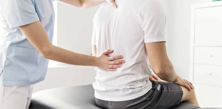 Physiotherapist providing bulging disc physiotherapy treatment at home in Karachi