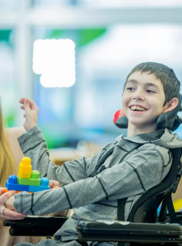 Physiotherapist providing cerebral palsy physiotherapy treatment at home in Karachi