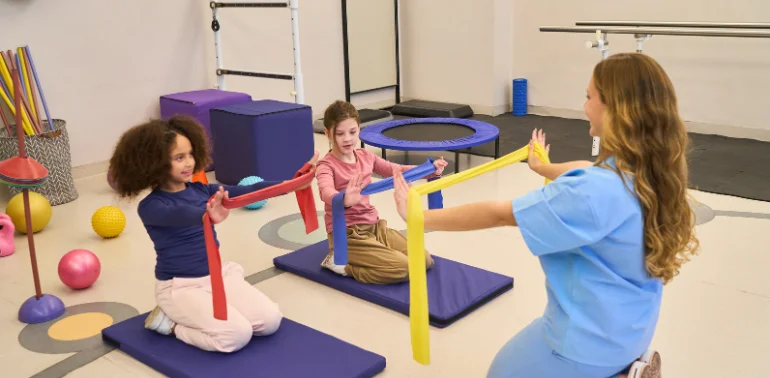 Physiotherapist providing developmental delay physiotherapy treatment at home in Karachi