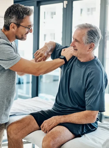 Physiotherapist providing elderly weakness physiotherapy treatment at home in Karachi