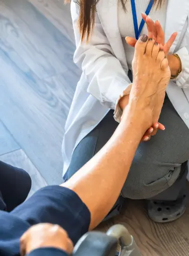 Physiotherapist providing foot drop physiotherapy treatment at home in Karachi