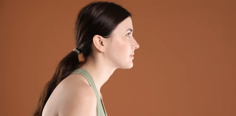 Physiotherapist providing forward head posture physiotherapy treatment at home in Karachi