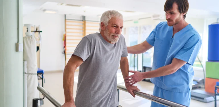 Physiotherapist providing geriatric gait disorder physiotherapy treatment at home in Karachi