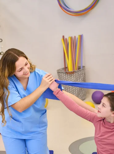 Physiotherapist providing hypertonia physiotherapy treatment at home in Karachi