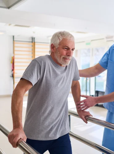 Physiotherapist providing mobility aids training physiotherapy treatment at home in Karachi