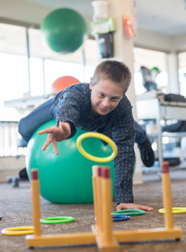 Physiotherapist providing pediatric balance disorder physiotherapy treatment at home in Karachi