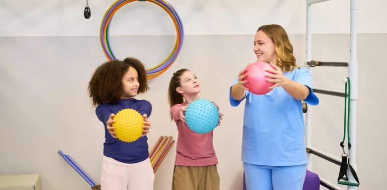 Physiotherapist providing pediatric sports injury physiotherapy treatment at home in Karachi