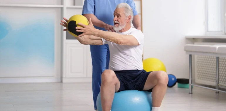 Physiotherapist providing postural instability physiotherapy treatment for the elderly at home in Karachi