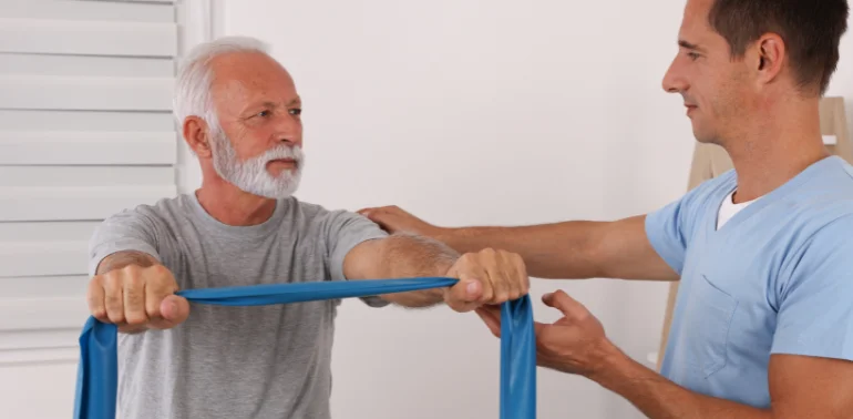 Physiotherapist providing sarcopenia physiotherapy treatment at home in Karachi
