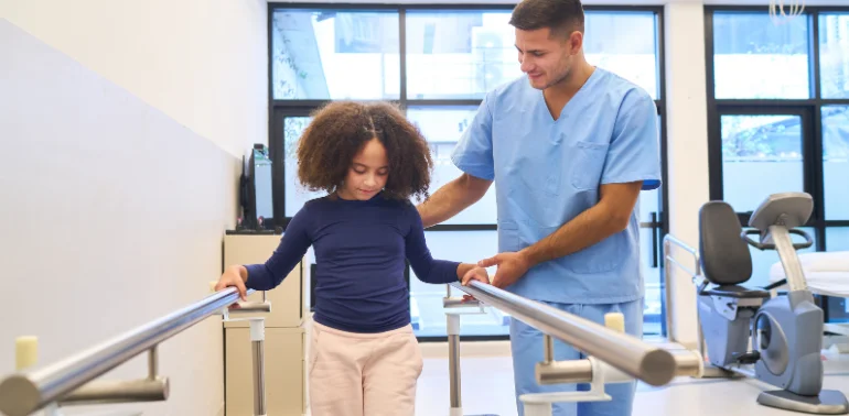 Physiotherapist providing toe walking physiotherapy treatment at home in Karachi