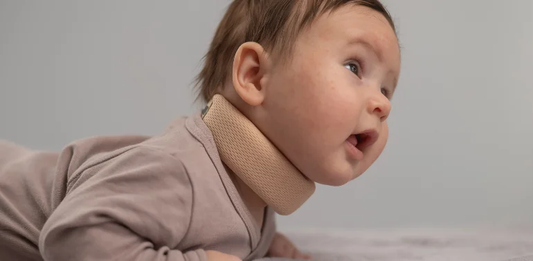 Physiotherapist providing torticollis physiotherapy treatment at home in Karachi