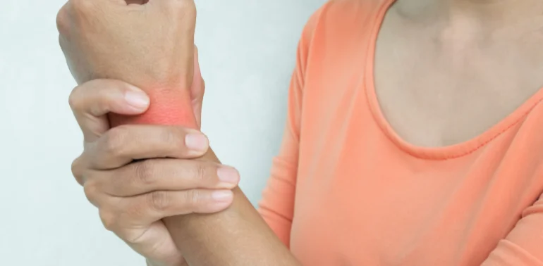 Physiotherapist providing wrist stiffness physiotherapy treatment at home in Karachi